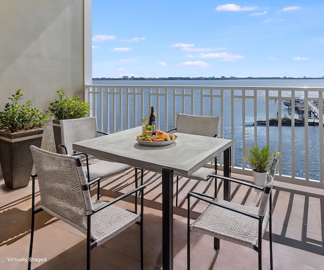 balcony featuring a water view