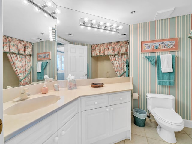 full bathroom with toilet, tile patterned flooring, vanity, and wallpapered walls