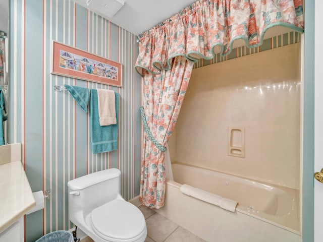 bathroom with wallpapered walls, toilet, tile patterned flooring, shower / bath combo with shower curtain, and vanity