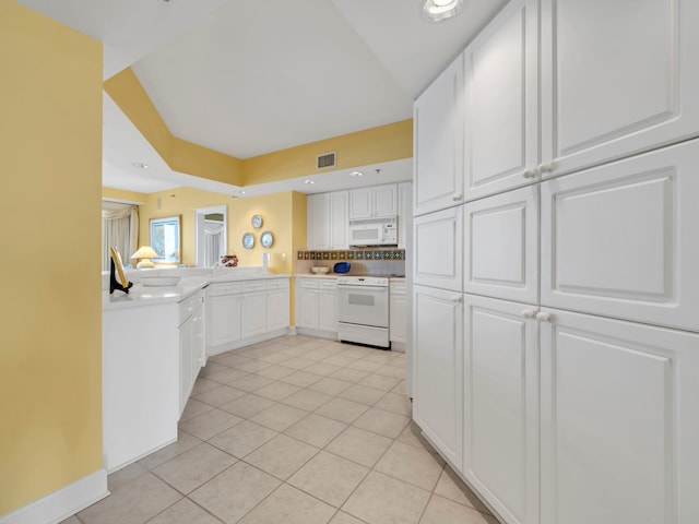 kitchen featuring light tile patterned floors, visible vents, decorative backsplash, white cabinets, and white appliances