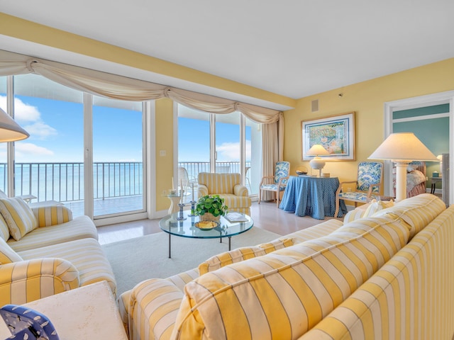 living area with a water view and visible vents