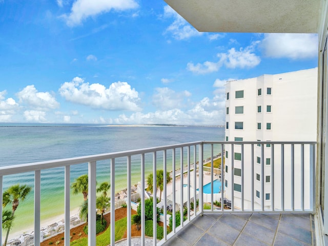 balcony with a view of the beach and a water view