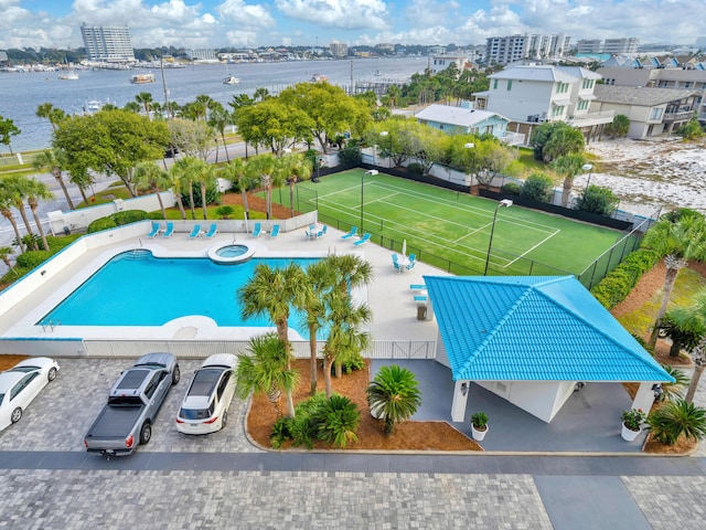 drone / aerial view featuring a water view and a city view