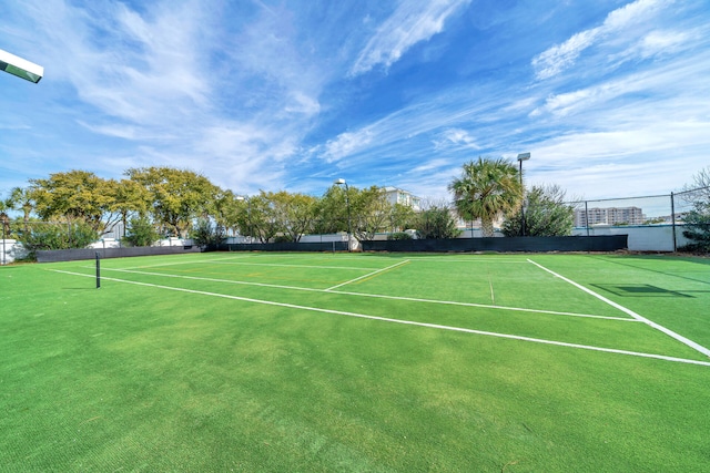 view of sport court with fence