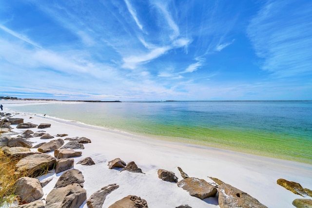 view of water feature with a beach view