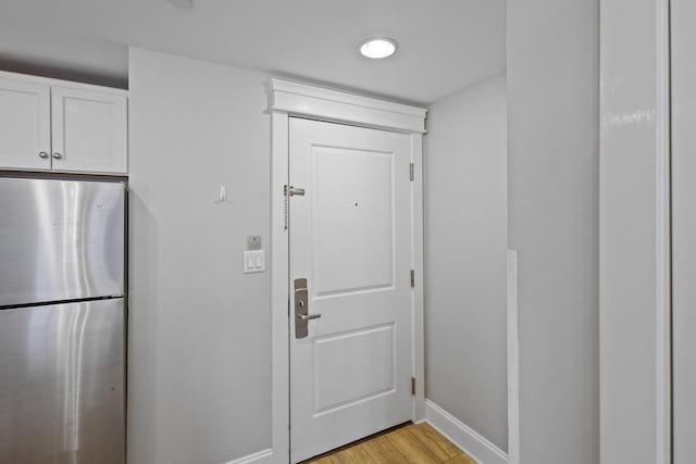 doorway to outside with light hardwood / wood-style floors