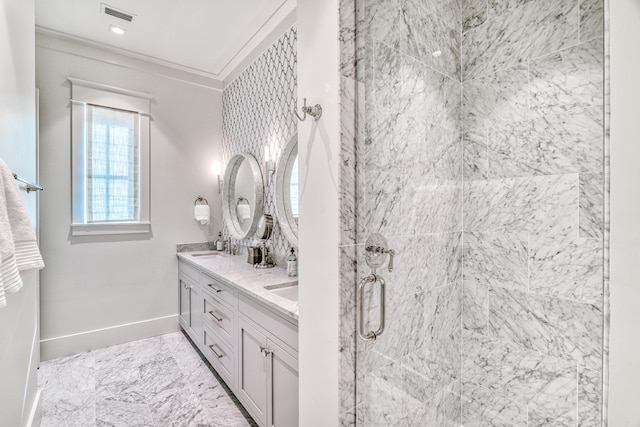 bathroom featuring ornamental molding, vanity, and an enclosed shower