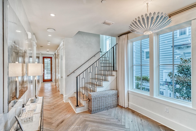 interior space featuring a wealth of natural light and parquet flooring