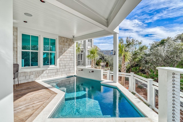 view of pool with a wooden deck