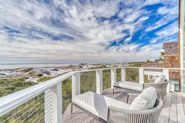 balcony featuring a water view