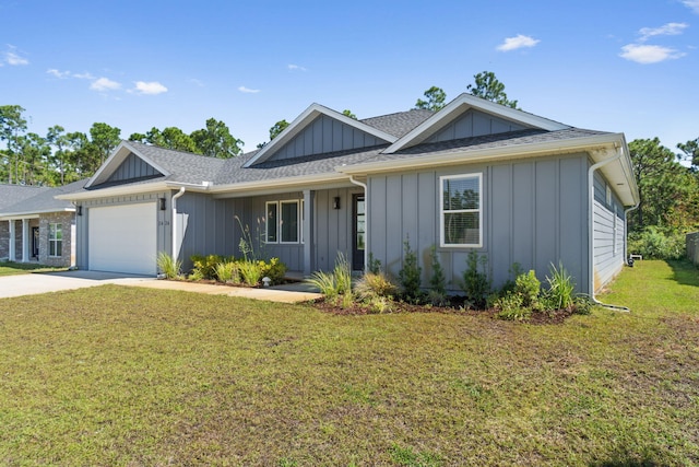 ranch-style house featuring a front lawn and a garage