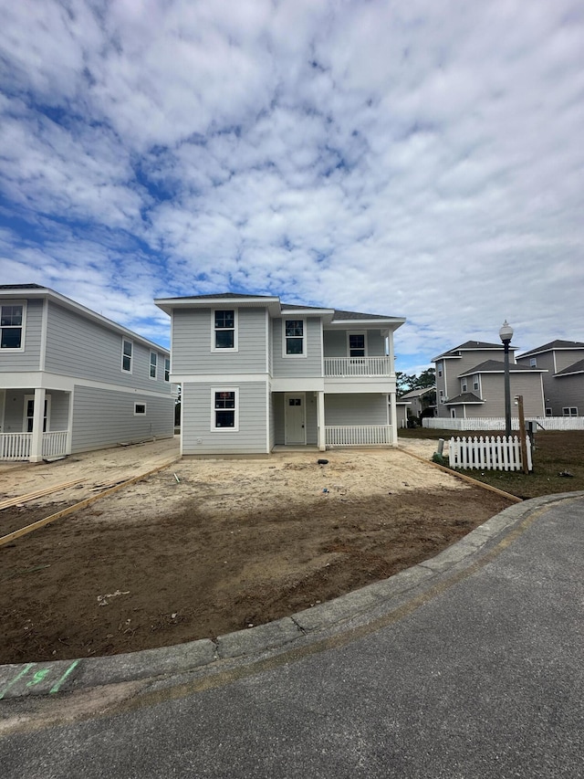 view of front of home with a balcony