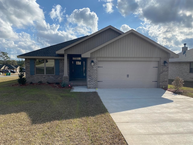 view of front of property with a garage and a front lawn