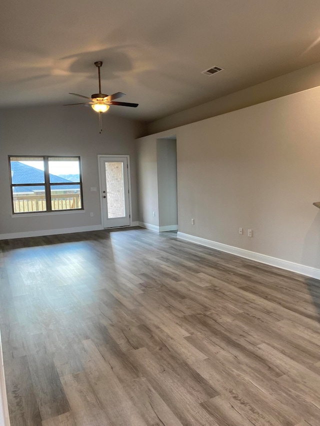 empty room featuring ceiling fan and hardwood / wood-style floors