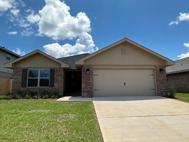 ranch-style home with a front yard and a garage