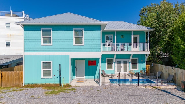 view of front of home with a balcony and covered porch