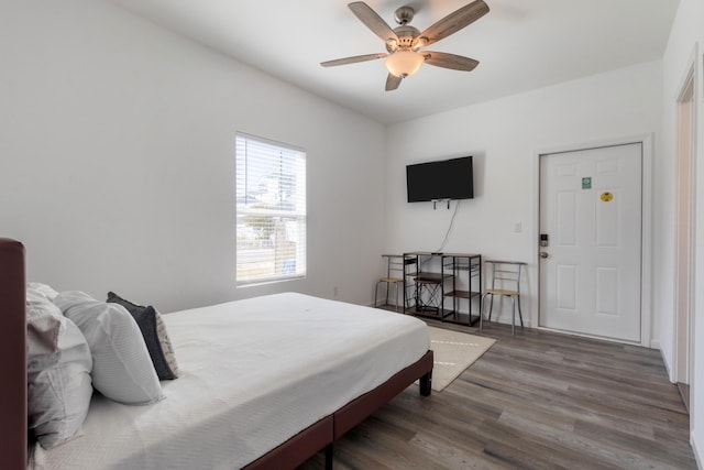 bedroom featuring dark wood-type flooring and ceiling fan