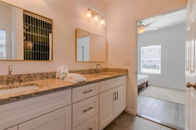 bathroom with vanity, wood-type flooring, and ceiling fan