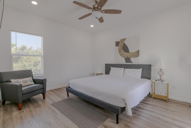 bedroom featuring ceiling fan and light hardwood / wood-style flooring