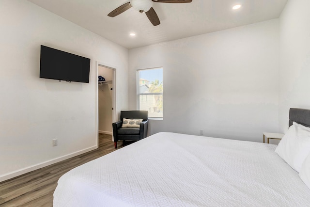 bedroom with ceiling fan and dark hardwood / wood-style flooring