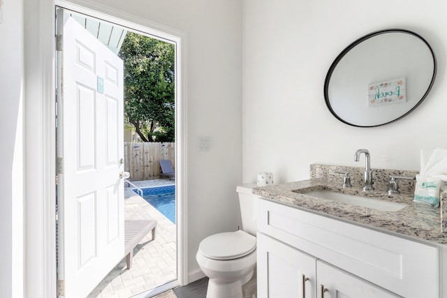 bathroom featuring vanity and toilet