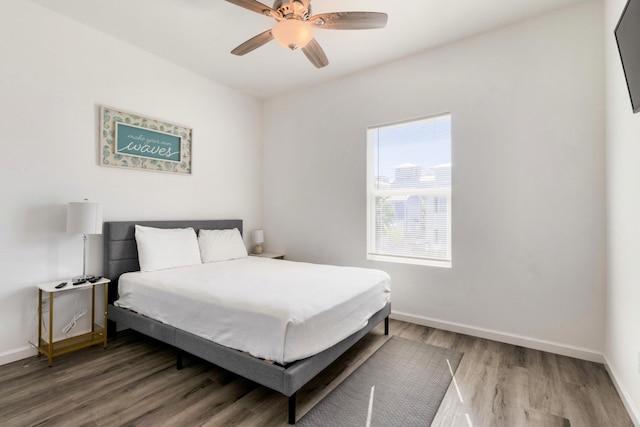 bedroom with ceiling fan and wood-type flooring