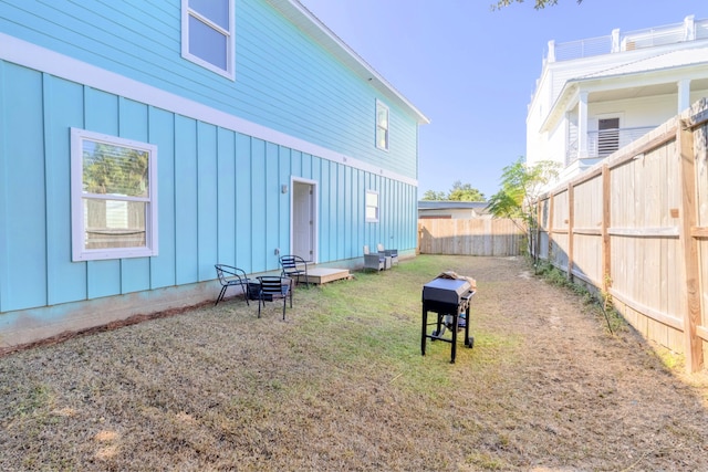 back of house with a lawn