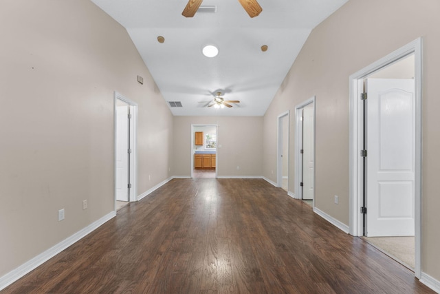 interior space with vaulted ceiling, ceiling fan, and dark hardwood / wood-style flooring