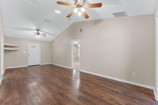 unfurnished living room with ceiling fan, dark wood-type flooring, and vaulted ceiling