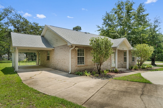 ranch-style home with a front lawn and a carport