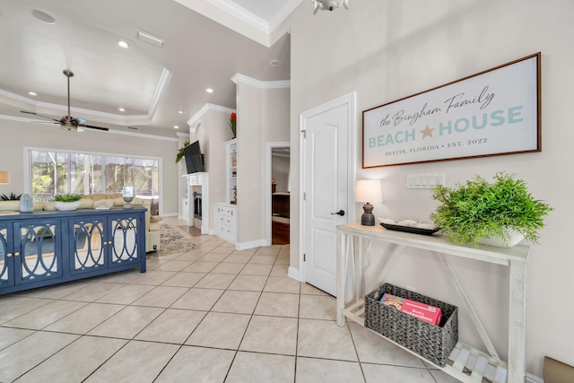 tiled bedroom featuring ornamental molding and a tray ceiling