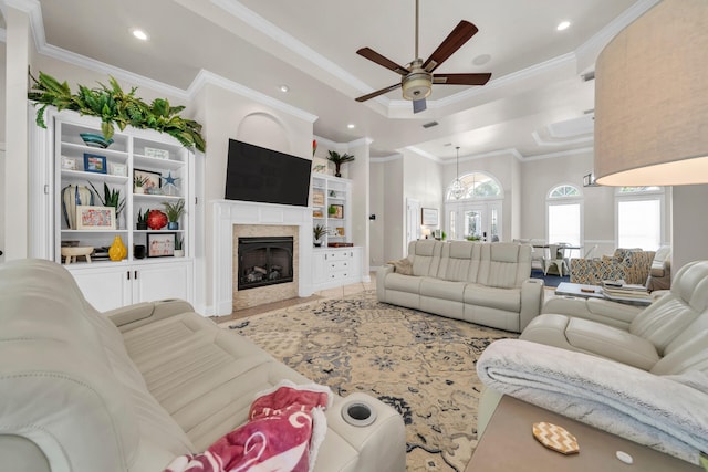 living room featuring crown molding and ceiling fan