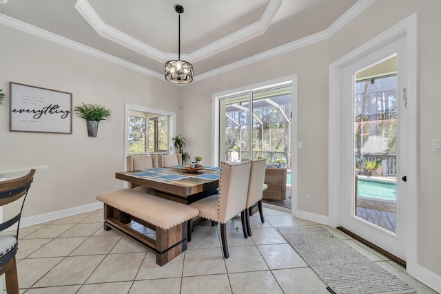 tiled dining area featuring crown molding