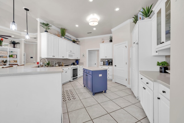 kitchen featuring ornamental molding, hanging light fixtures, white appliances, and kitchen peninsula