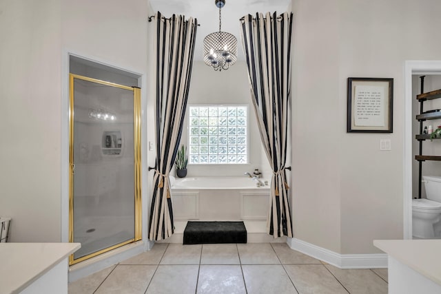 full bathroom with toilet, shower with separate bathtub, vanity, and tile patterned flooring