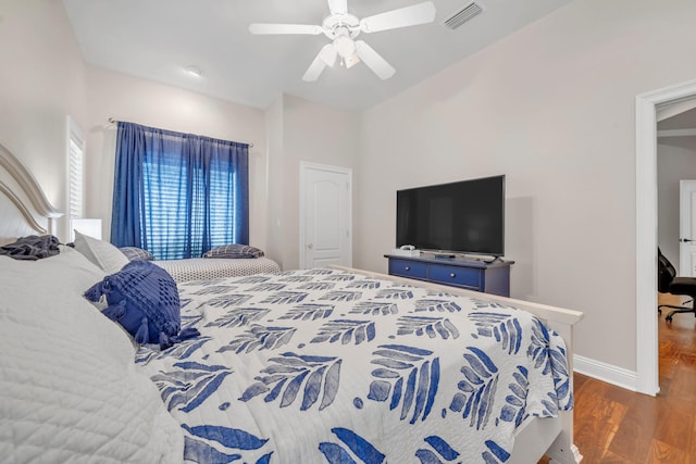 bedroom featuring dark wood-type flooring and ceiling fan