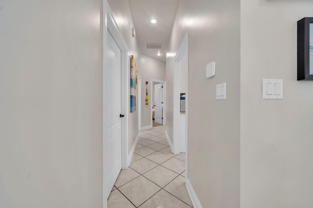 hallway with light tile patterned floors