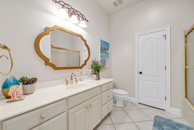 full bathroom with vanity, toilet, enclosed tub / shower combo, and tile patterned flooring