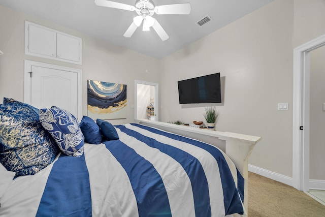 bedroom with ceiling fan and light carpet