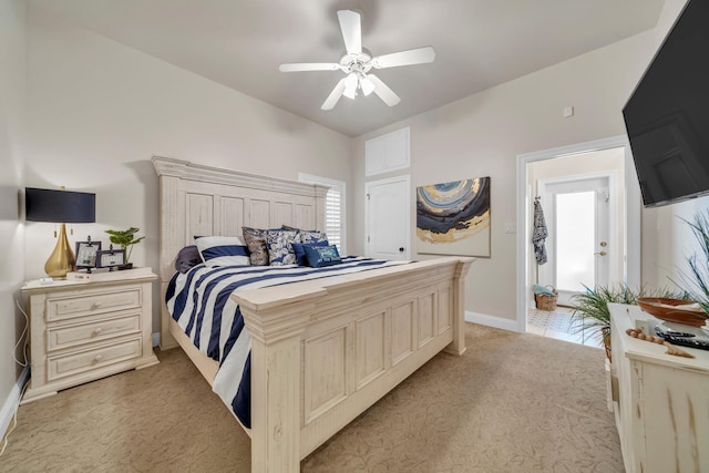 bedroom featuring light colored carpet and ceiling fan