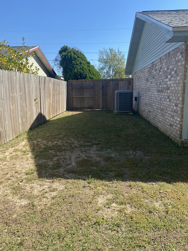 view of yard featuring central AC