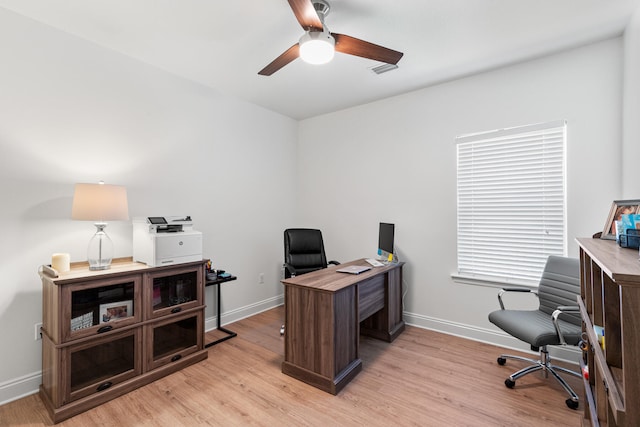 office space with light hardwood / wood-style flooring and ceiling fan