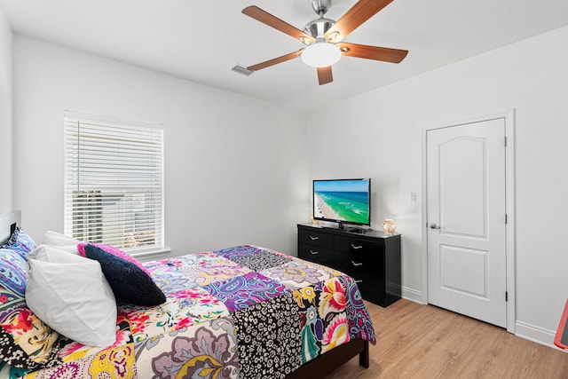 bedroom featuring light hardwood / wood-style floors and ceiling fan