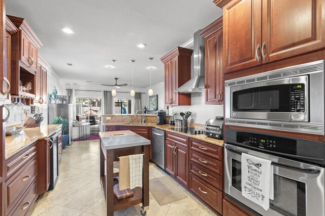 253 Okeechobee Cv, Destin, FL 32541 - kitchen with appliances with stainless steel finishes, a peninsula, wall chimney exhaust hood, ornamental molding, and a sink