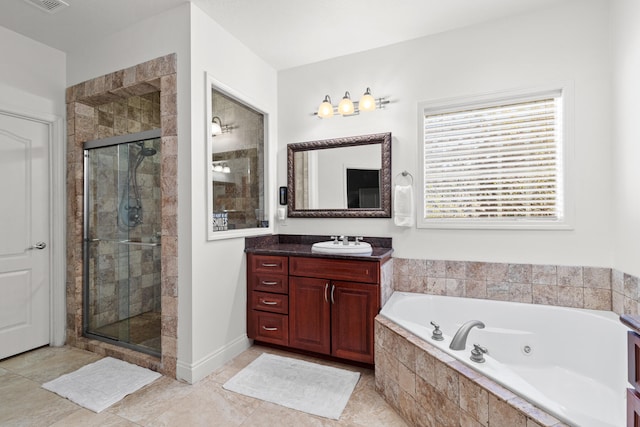 bathroom with vanity, tile patterned floors, and independent shower and bath