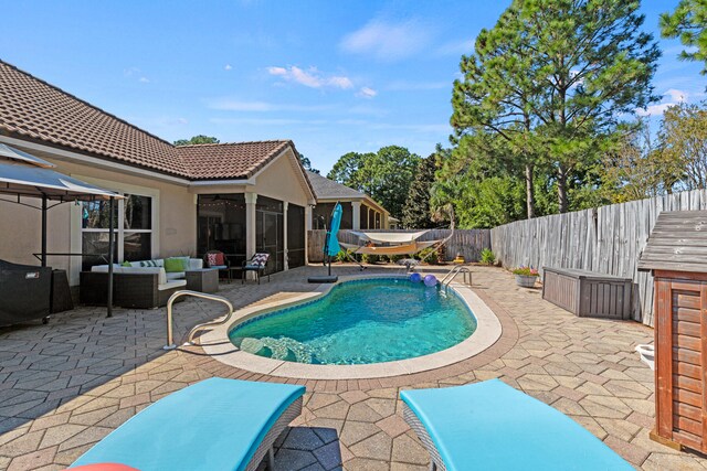 view of pool with a patio, a jacuzzi, and an outdoor living space