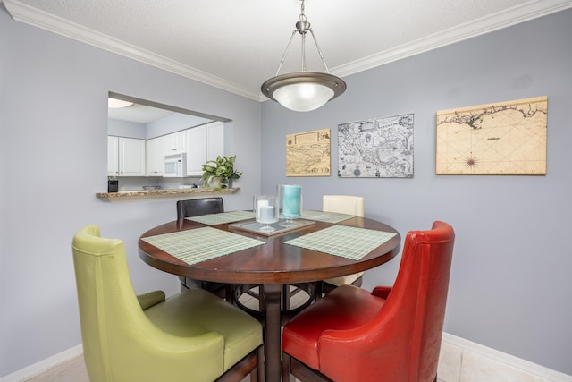 dining space with crown molding, a textured ceiling, and light tile patterned floors