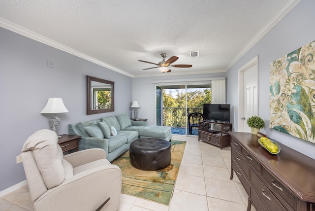 tiled living room featuring ornamental molding, a textured ceiling, and ceiling fan