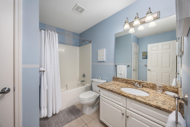 full bathroom with a textured ceiling, toilet, shower / bath combo with shower curtain, vanity, and tile patterned floors