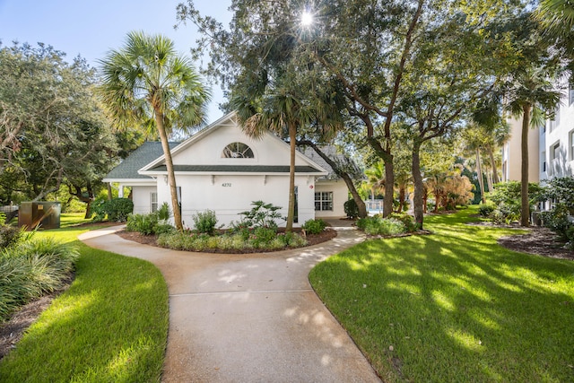 view of side of home with a garage and a lawn